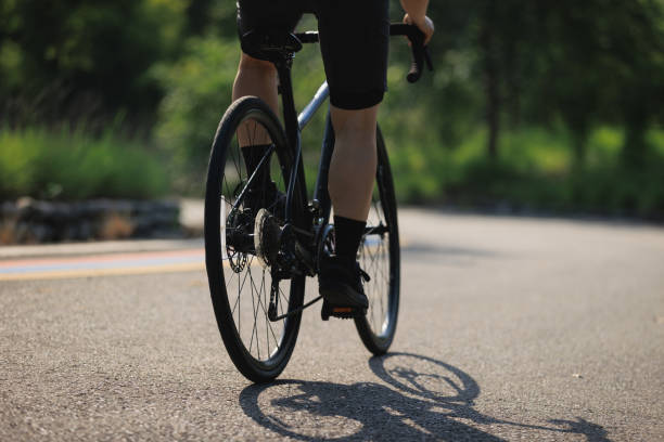 istock Cyclist riding bike at summer park 2197058853