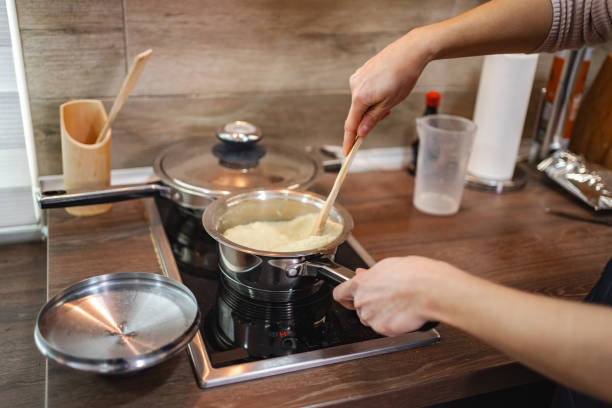 istock Stirring creamy rice in a modern kitchen on a cozy afternoon 2197060020