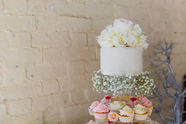 istock Iced wedding cake in tiers with sugar flowers 2197060781