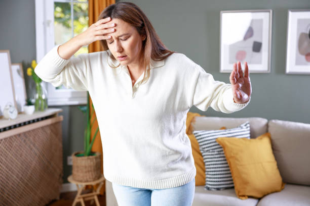 istock Young woman suffering from vertigo or dizziness problem of brain or inner ear 2197063555