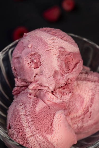 istock raspberry cream ice cream with ripe raspberries and blackberries 2197068931