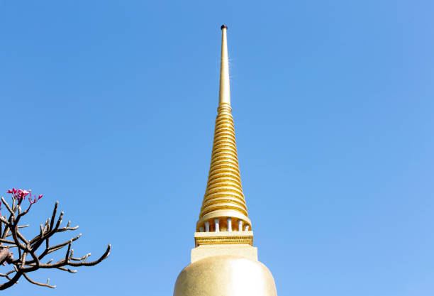 Shot in color detail on the facade of this historic building representing some character, animal or flower. Inside a buddhist temple in the city of bangkok.Set at Bangkok, Thailand, Asia