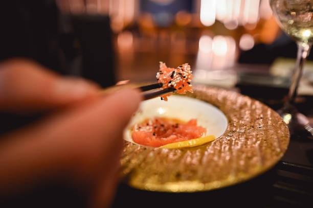 Eating salmon tartar close up.