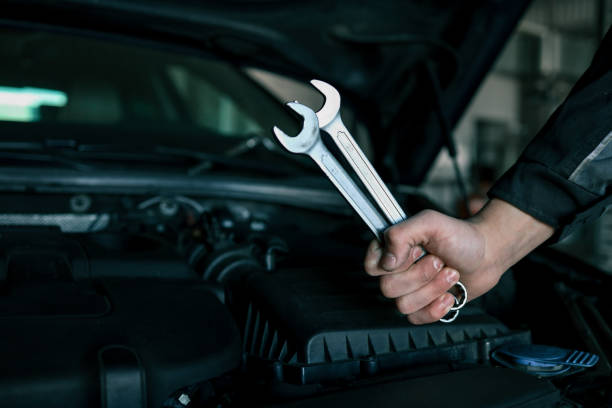 An annual engine check can help prevent engine damage. Close up mechanical engineer hand insert the plastic tube into engine crankcase to collect engine oil for used oil analysis to prevent engine breakdown.