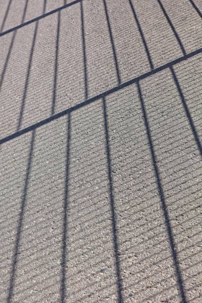 istock Shadow of metal fence grid. 2197074689