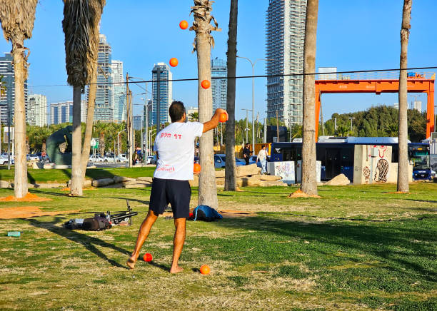 Tel Aviv, Israel - January 8, 2025: Juggler in Charles Clore Park. It is a sprawling beachfront park of public land along the Mediterranean Sea in southwestern Tel Aviv, Israel