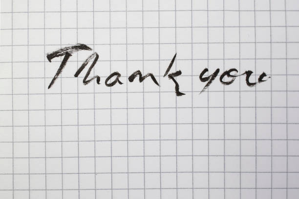 THANK YOU! lettering on a notebook page with a blue bookmark.