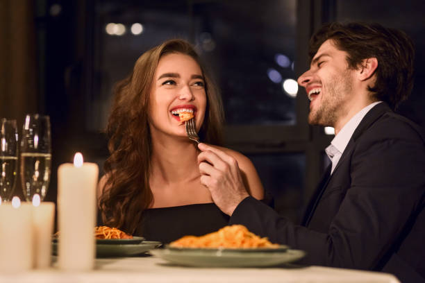 istock Loving couple feeding each other 2197080898