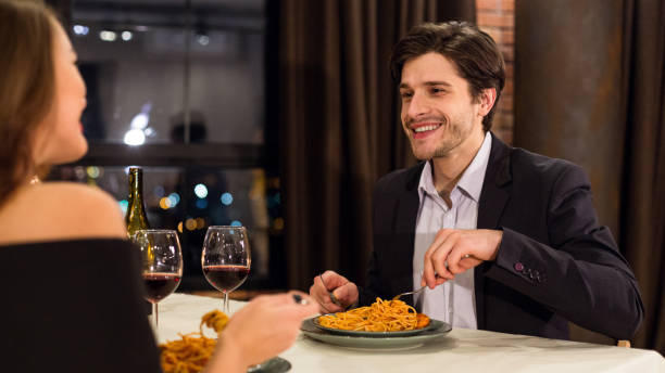 istock Romantic Dinner Date in a Cozy Restaurant With a City View at Night 2197080915
