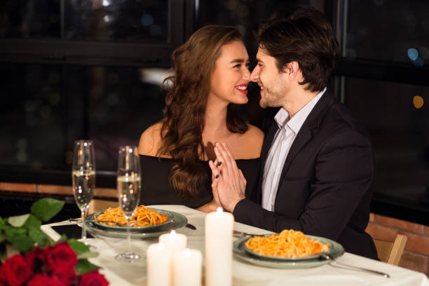 istock Romantic Dinner With Candlelight and Pasta in a Cozy Restaurant Setting 2197080926