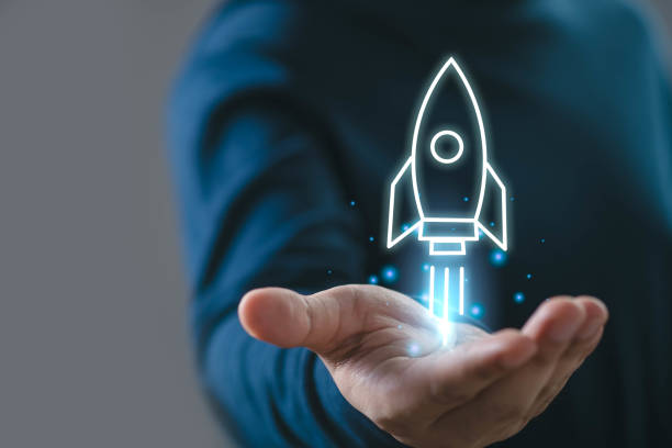 istock Hand holding a digital rocket representing innovation, technology, and startup growth. Perfect for business and tech themes. 2197083369