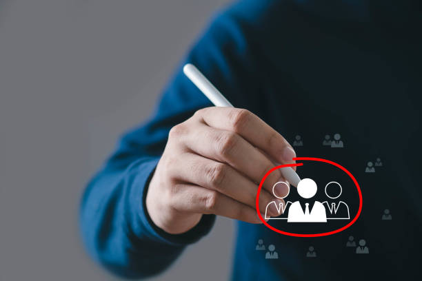 istock Person using a pen to select a group of people icon, concept for target audience, recruitment, or personalization. 2197083417