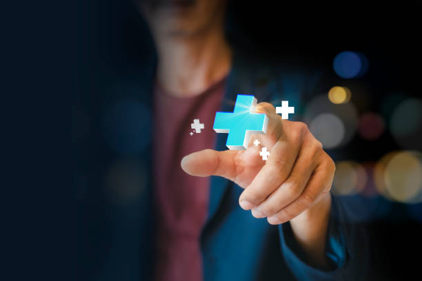 istock Businessman touch interacting with a blue plus sign, representing a mindset of positivity, mental health care, and insurance in mental rejuvenation, positive thinking mindset 2197083480
