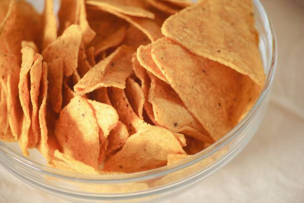 istock Glass bowl full of corn chips on the table. Close-up 2197083922
