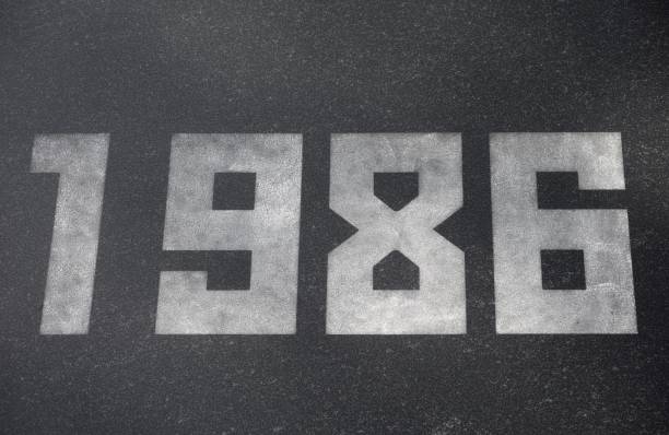 istock Black granite slab with white numbers 1986 on it 2197083927