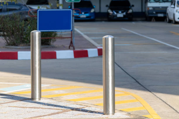 istock two metal poles or stainless steel bollard on footpath. 2197085693
