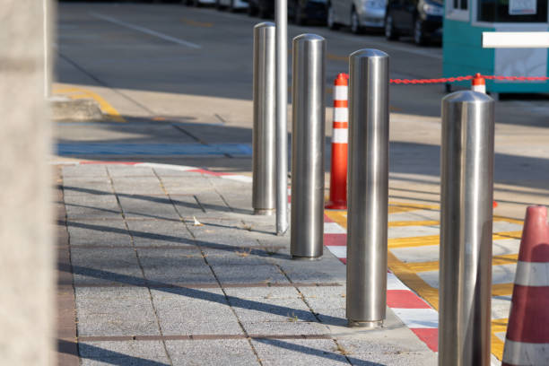 istock stainless steel bollard on footpath. 2197085715