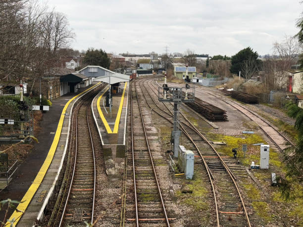 istock Platforms and tracks at a railway station 2197086585
