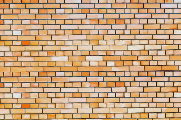 Wall of brown brick of different color