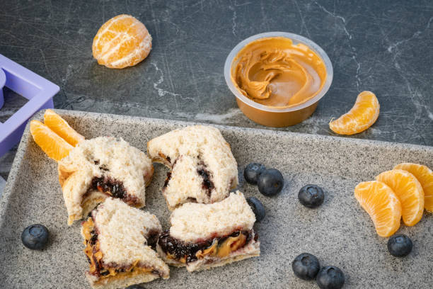Peanut butter and jelly sandwich with clipping path on white background.  Please see my portfolio for other food and drink images.