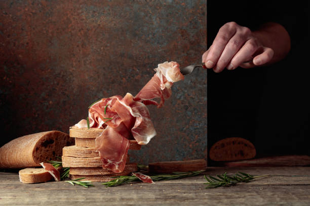 istock The hand of a prosciutto thief. 2197098693