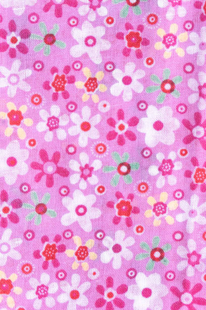 istock Pink floral fabric background with white and red flowers 2197100858