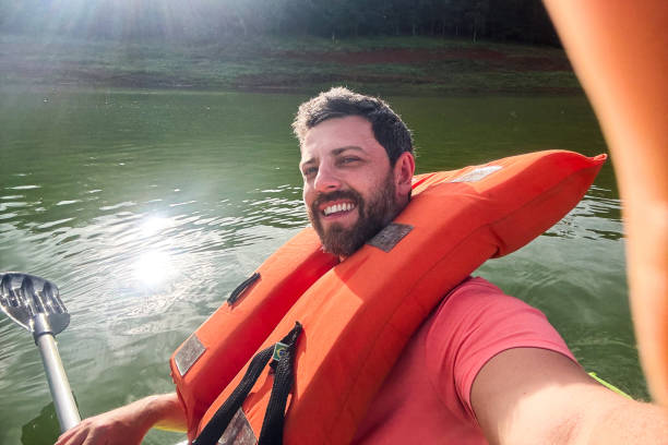 istock Mature man filming himself on kayak trip 2197104021