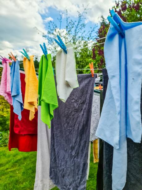 istock Fresh laundry drying on clothesline in a garden 2197111540