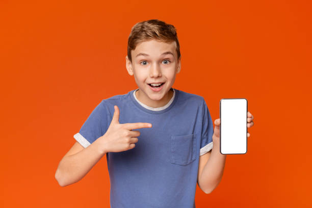 istock Cute boy man showing blank cellphone screen 2197112132