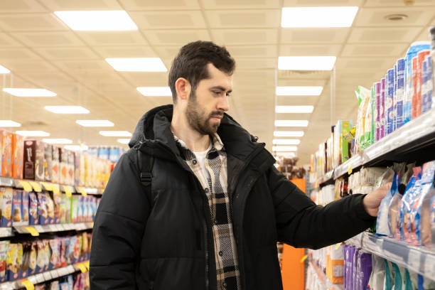 istock A young man shopping at groceries. 2197115101