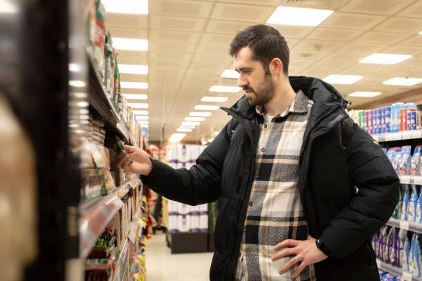 istock A young man shopping at groceries. 2197115527