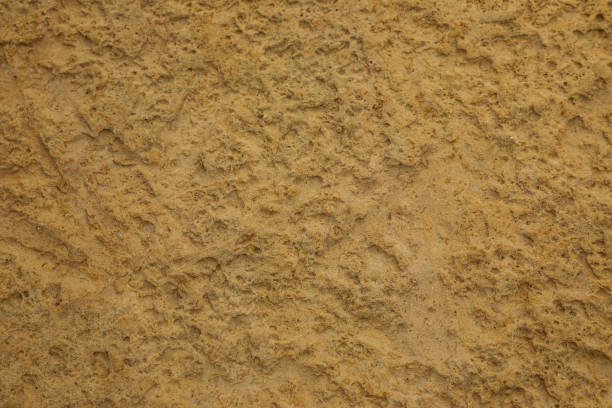 Structured sandstone backdrop from which many buildings are constructed, including the fortified walls of Malta