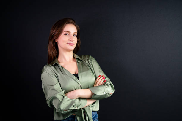 istock young businesswoman on black background 2197118179