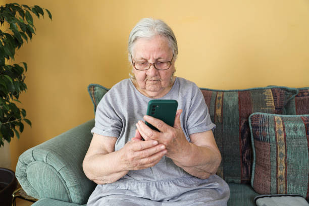 istock Elderly woman with smartphone, 80 + 2197120078