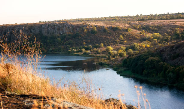 istock a huge wide river flows among steep banks 2197124918