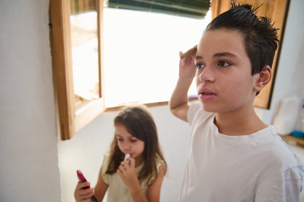 istock Sibling Routine with Grooming and Brushing Teeth in Bright Morning Light 2197125526