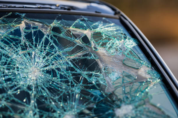 istock Crushed front window of a small car.. 2197126817