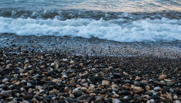 istock sea wave on the beach with pebbles 2197129168
