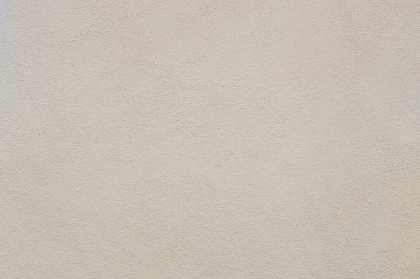 istock View of a beige cement wall on a summer day. 2197131976