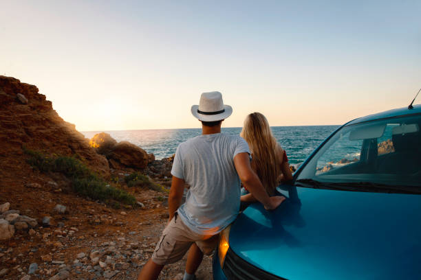 Young couple on the road trip discovering coastline