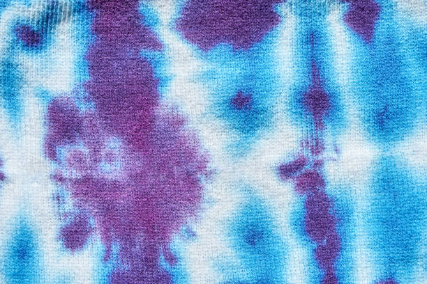 istock Abstract blue and purple tie dye pattern on fabric with symmetrical design 2197142303