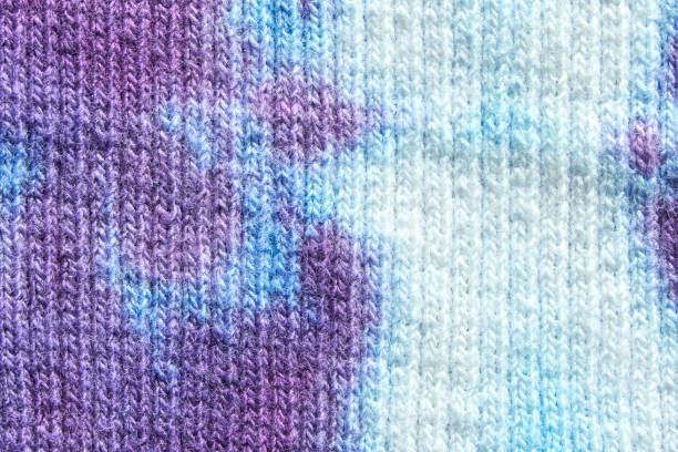 istock Close up of multicolored knitted fabric texture with purple and blue patterns 2197142336