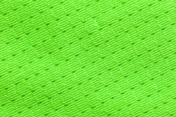 Bright neon green textured fabric with intricate zigzag pattern for fashion