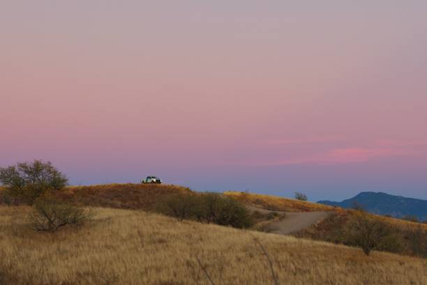 Border Patrol on a Hill at Sunset