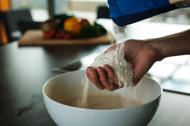 istock Sifting flour on female hand 2197152814