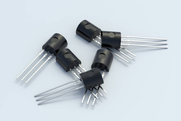 transistor sparsi su sfondo grigio chiaro. componente elettronico. parte del circuito elettrico. rendering 3d - transistor foto e immagini stock