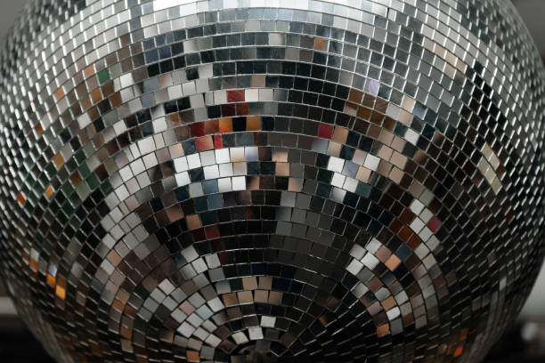 istock disco ball with mirror surface and bright rays, hanging on ceiling, night party background 2197158568