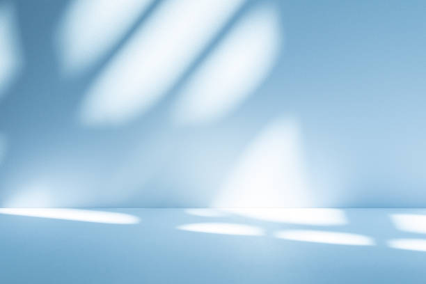 istock Studio style background wall decoration presentation uses white and blue tones. with shadows cast from a nearby window, concept creating a decorative 2197160307