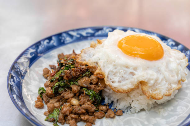 istock Stir-fried Thai holy basil with minced pork with rice and fried egg. 2197163764