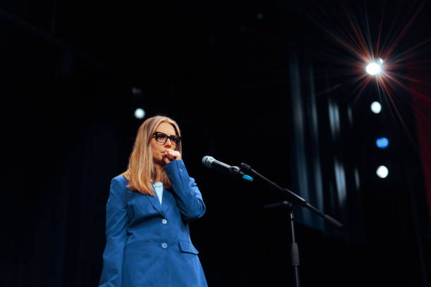 istock Woman clears her Throat before Giving a Public Speech 2197165909